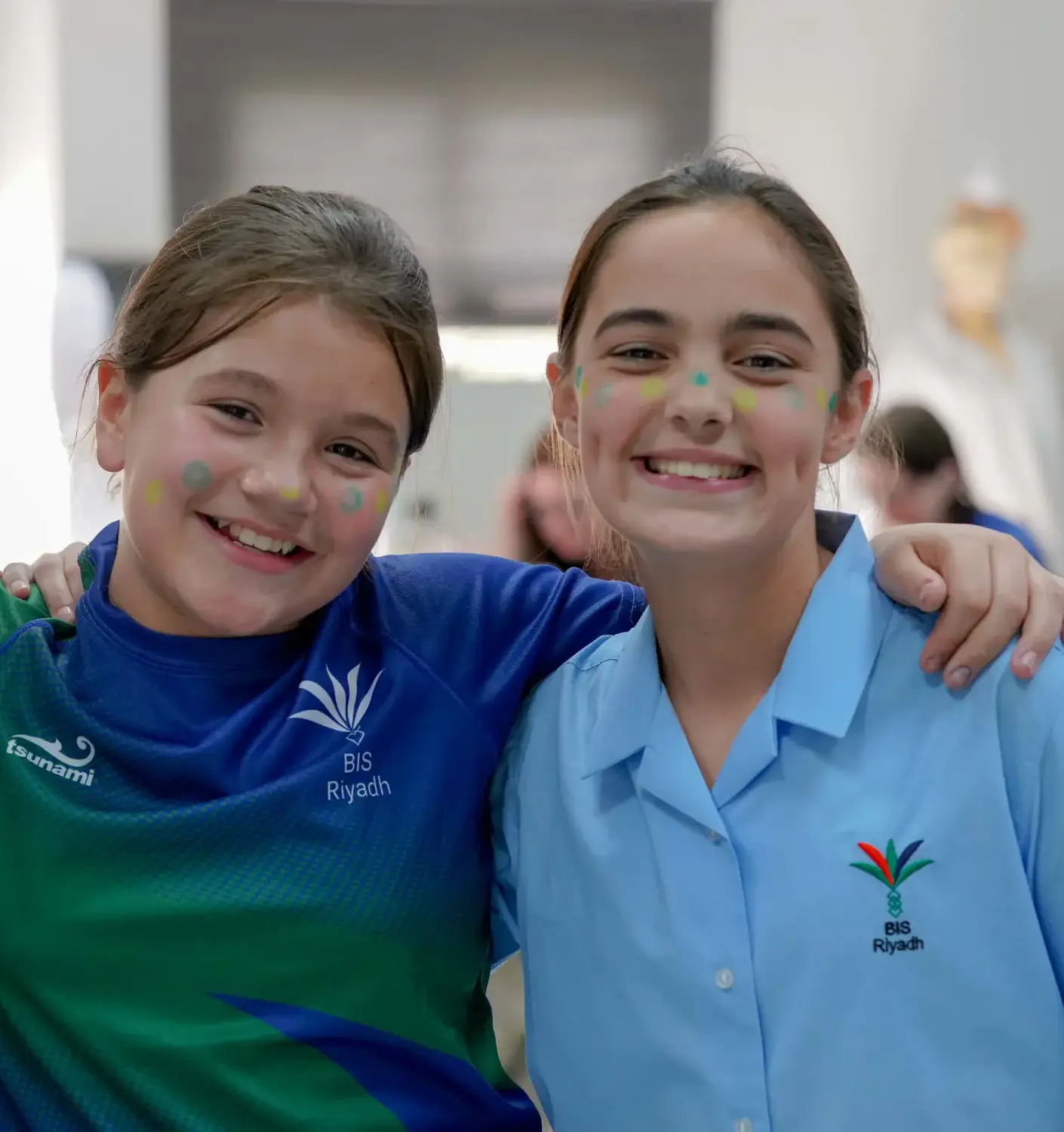 BISR Al Hamra students smiling for a photograph together.