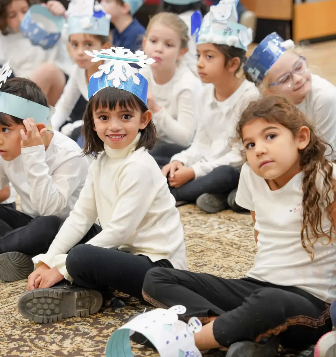 BISR Al Hamra junior students wearing snowflake crowns