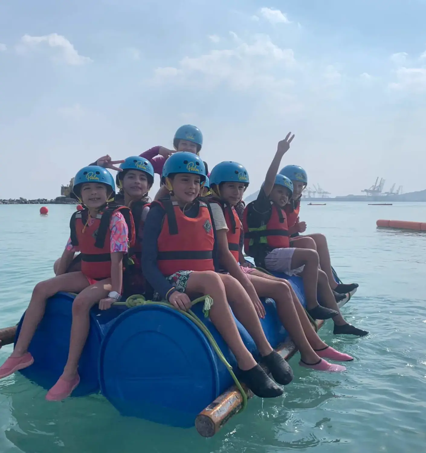 BISR students sitting on a raft together during a trip to the UAE.